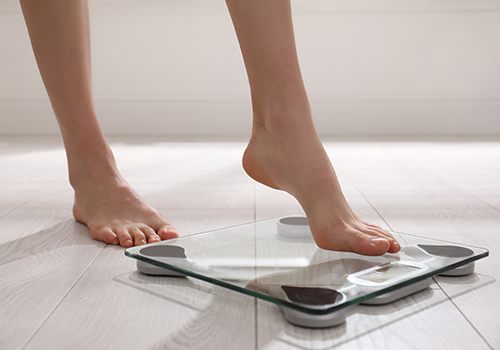 Person stepping on scale