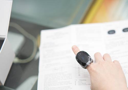 Person wearing monitoring ring on finger